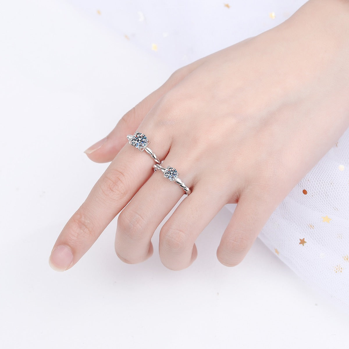 Round Moissanite Twisted Solitaire Ring with CZ worn on hand to show scale, band width, and ring profile