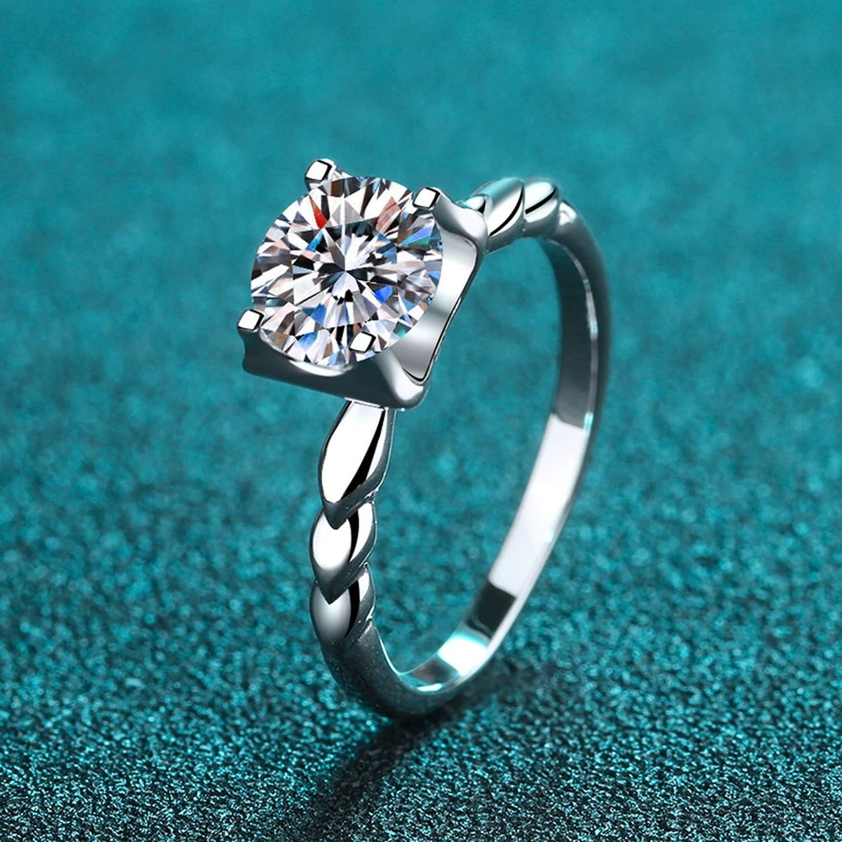 Round Moissanite Twisted Solitaire Ring with CZ product view showing moissanite setting and metal finish