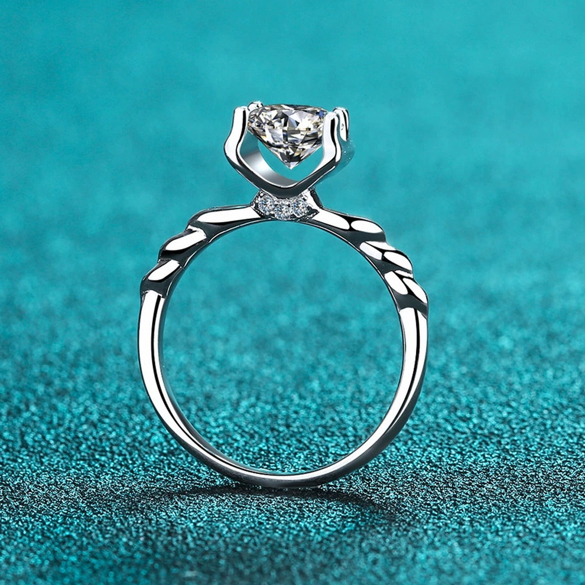 Round Moissanite Twisted Solitaire Ring with CZ product view showing moissanite setting and metal finish