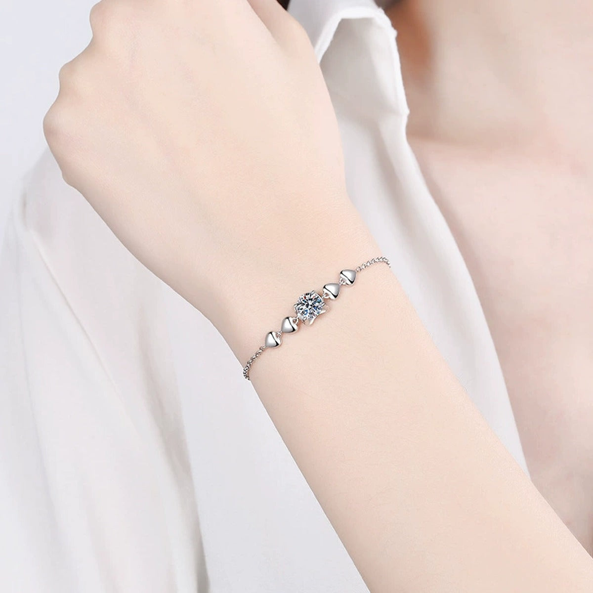 Heart Accent Moissanite Adjustable Bracelet in Rhodium-Plated S925 sterling silver worn on wrist model view showing scale and adjustable fit