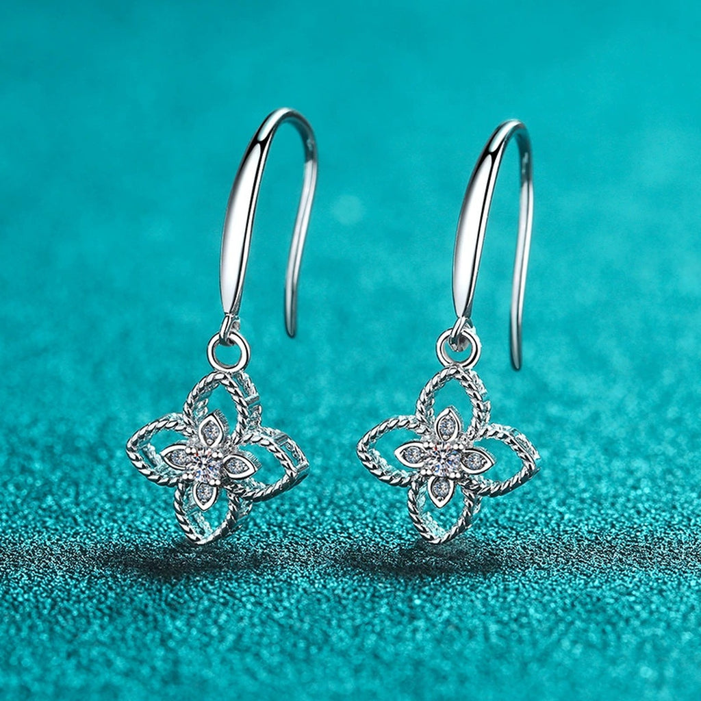Floral Moissanite Hook Dangle Earrings in Rhodium-Plated S925 Sterling Silver on blue-green fabric showing front detail