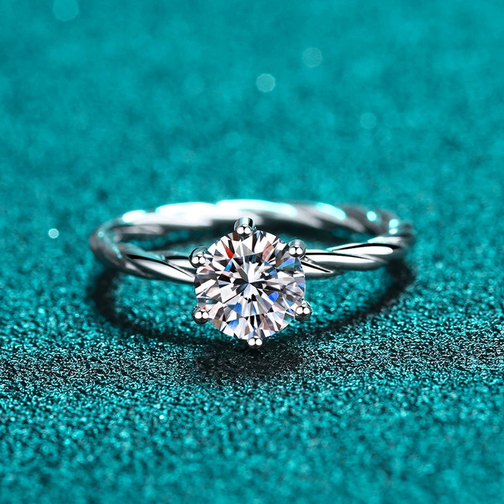 Round Moissanite Ring in Rhodium-Plated S925 Sterling Silver blue display product photo showing the moissanite setting and band profile
