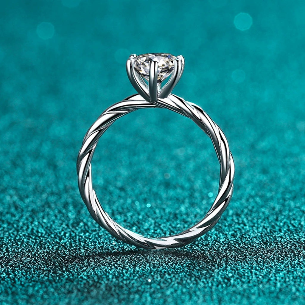 Round Moissanite Ring in Rhodium-Plated S925 Sterling Silver blue display product photo showing the moissanite setting and band profile
