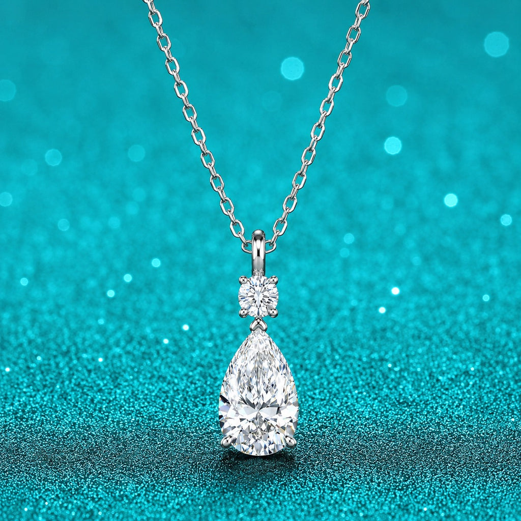 Pear and Round Moissanite Drop Necklace in Rhodium-Plated S925 sterling silver close-up product scene showing pendant setting