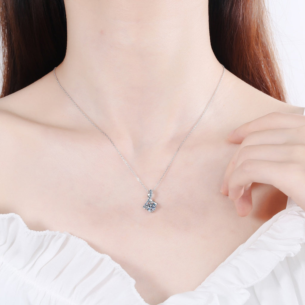 Music Note Moissanite Pendant Necklace with CZ in Rhodium-Plated S925 sterling silver worn on neckline by model showing scale and adjustable chain styling