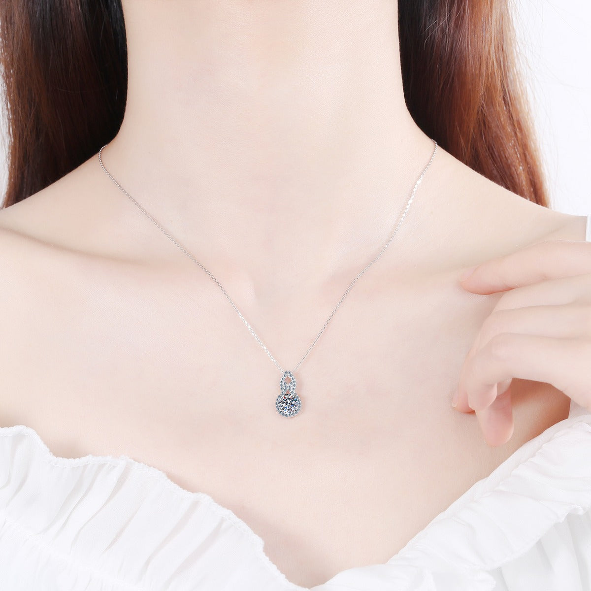 Gourd Moissanite Pendant Necklace with CZ in Rhodium-Plated S925 sterling silver worn on neckline by model showing scale and adjustable chain styling