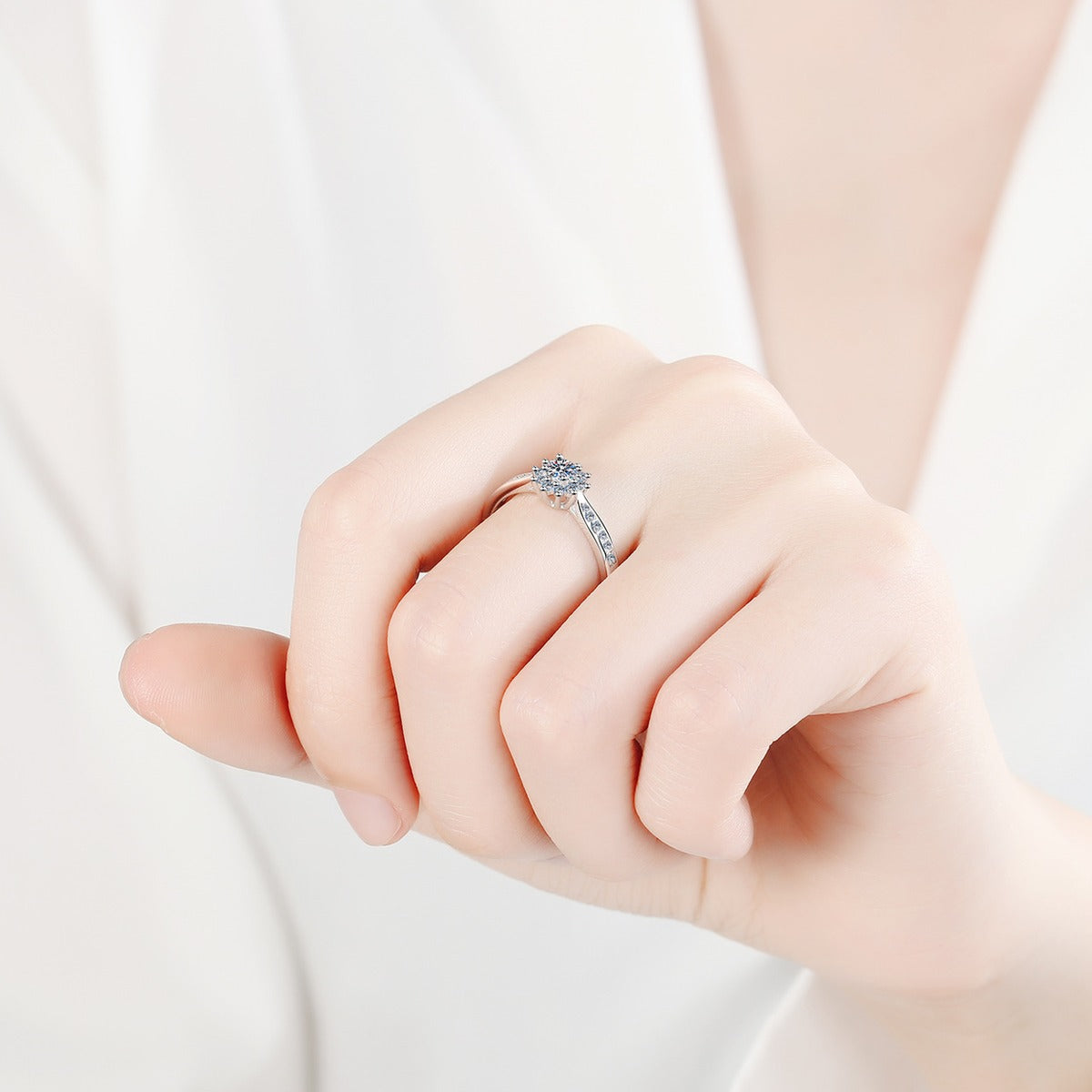 Round Floral Cluster Moissanite Ring with CZ worn on hand to show scale, band width, and ring profile