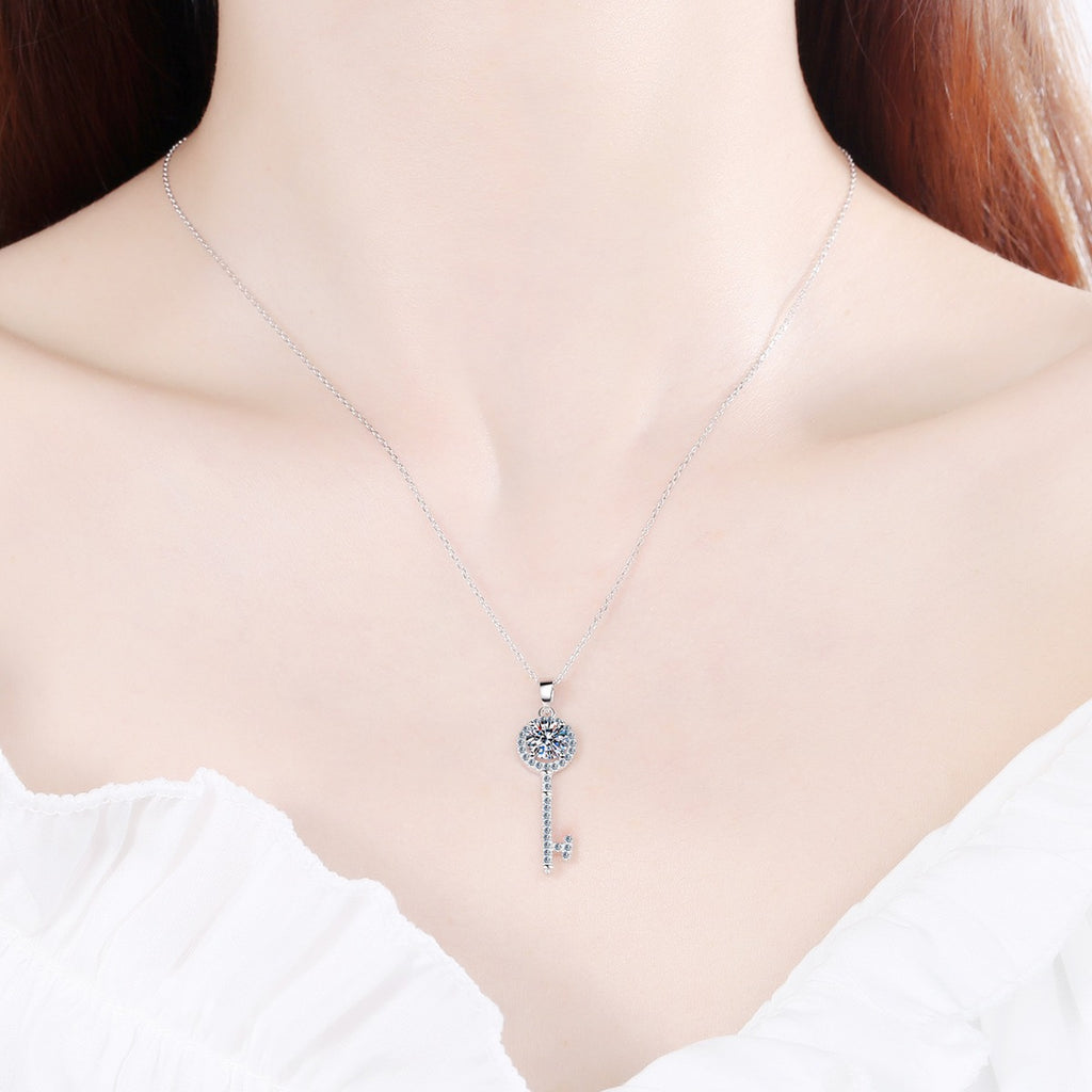 Floral Key Moissanite Pendant Necklace with CZ in Rhodium-Plated S925 sterling silver worn on neckline by model showing scale and adjustable chain styling
