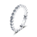 Round Moissanite Pave Stackable Band Ring in rhodium-plated S925 sterling silver on clean white background