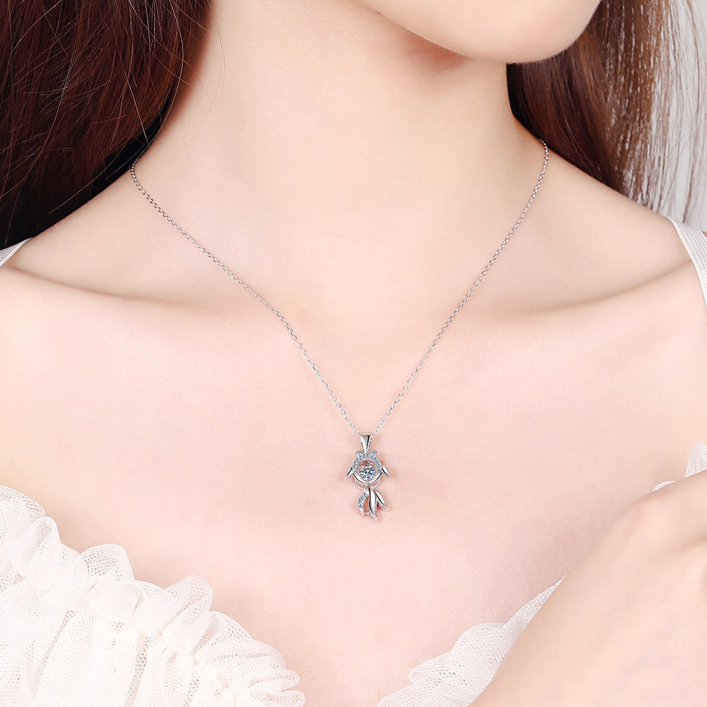 Fish Moissanite Pendant Necklace with CZ in Rhodium-Plated S925 sterling silver worn on neckline by model showing scale and adjustable chain styling