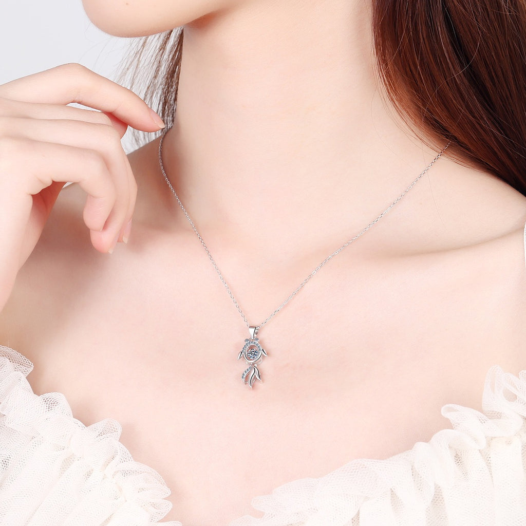 Fish Moissanite Pendant Necklace with CZ in Rhodium-Plated S925 sterling silver worn on neckline by model showing scale and adjustable chain styling