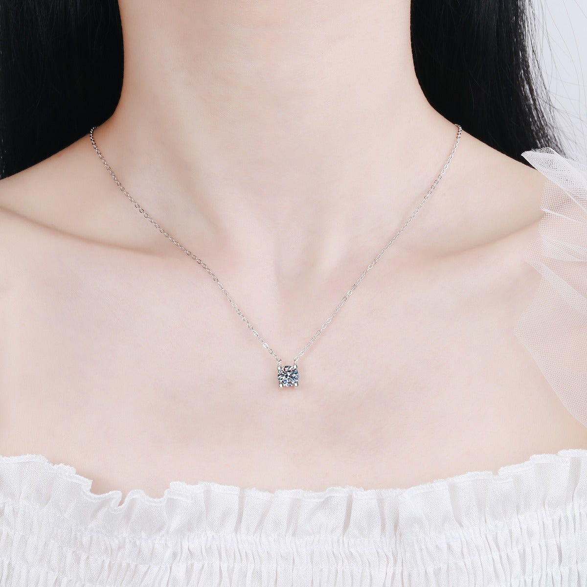 Solitaire Moissanite Pendant Necklace in Rhodium and Rose Gold-Plated S925 sterling silver worn on neckline by model showing scale and adjustable chain styling
