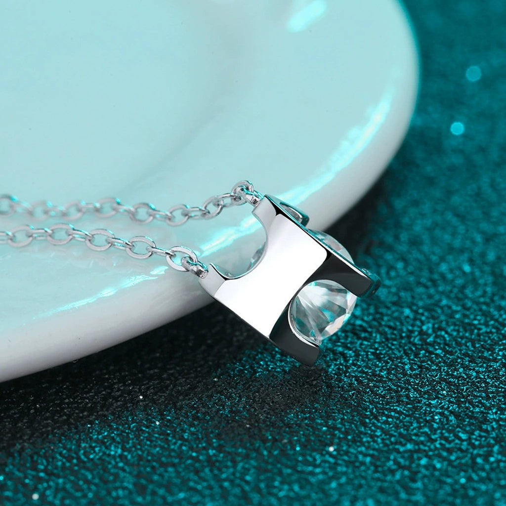 Solitaire Moissanite Pendant Necklace in Rhodium and Rose Gold-Plated S925 sterling silver product scene view showing chain and setting detail