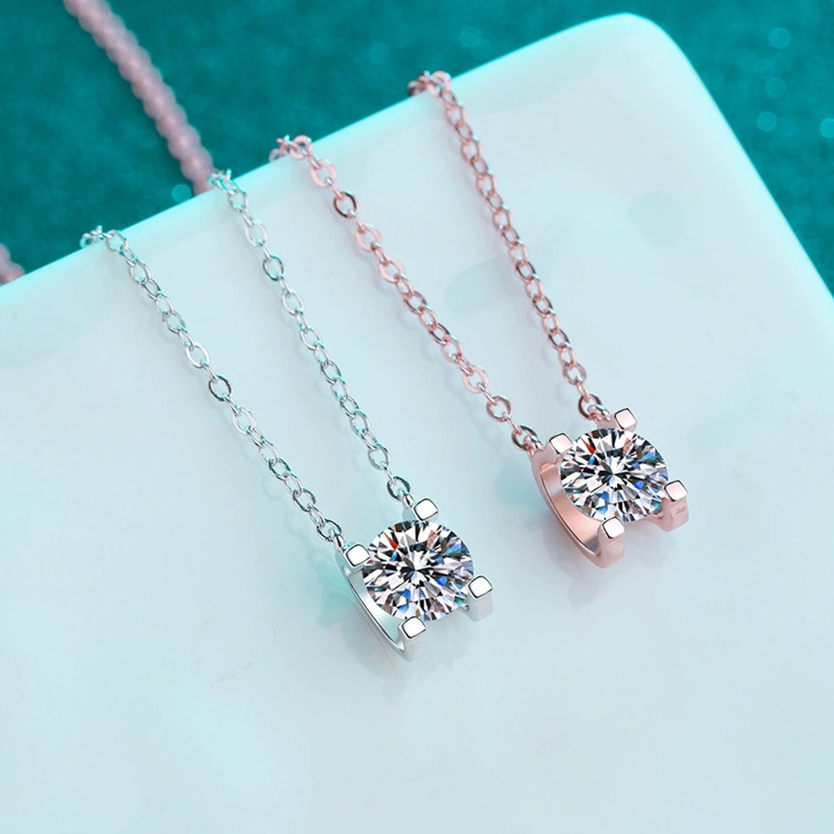 Solitaire Moissanite Pendant Necklace in Rhodium and Rose Gold-Plated S925 sterling silver product scene view showing angled sparkle