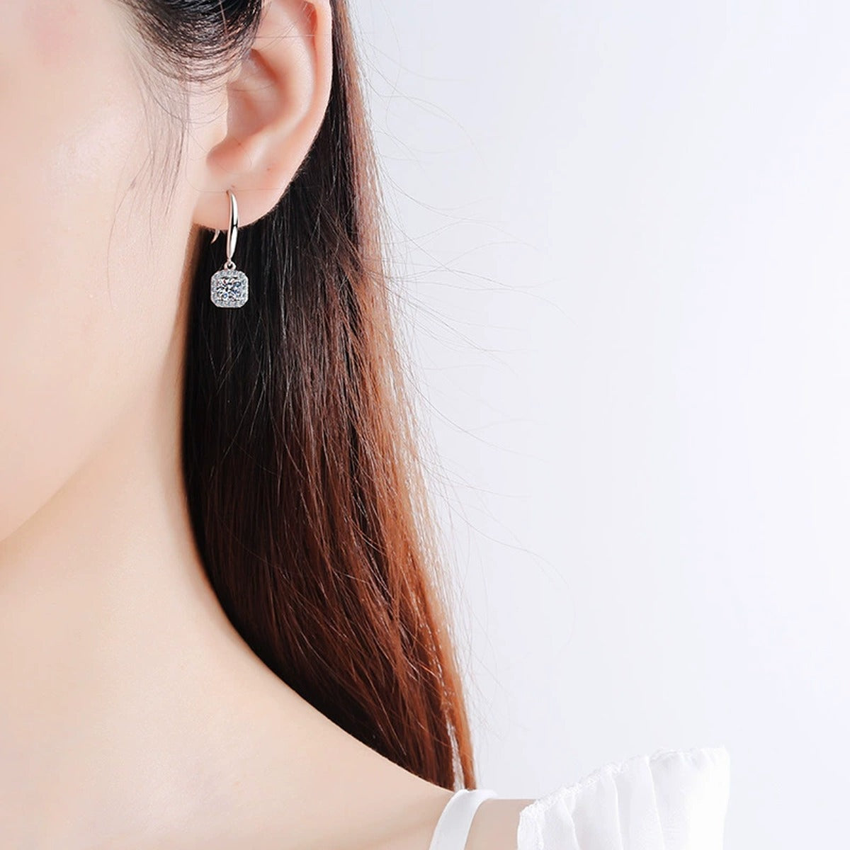 Round Halo Moissanite Hook Dangle Earrings with CZ in Rhodium-Plated S925 sterling silver worn on ear by model showing scale, placement, and hook dangle earrings styling