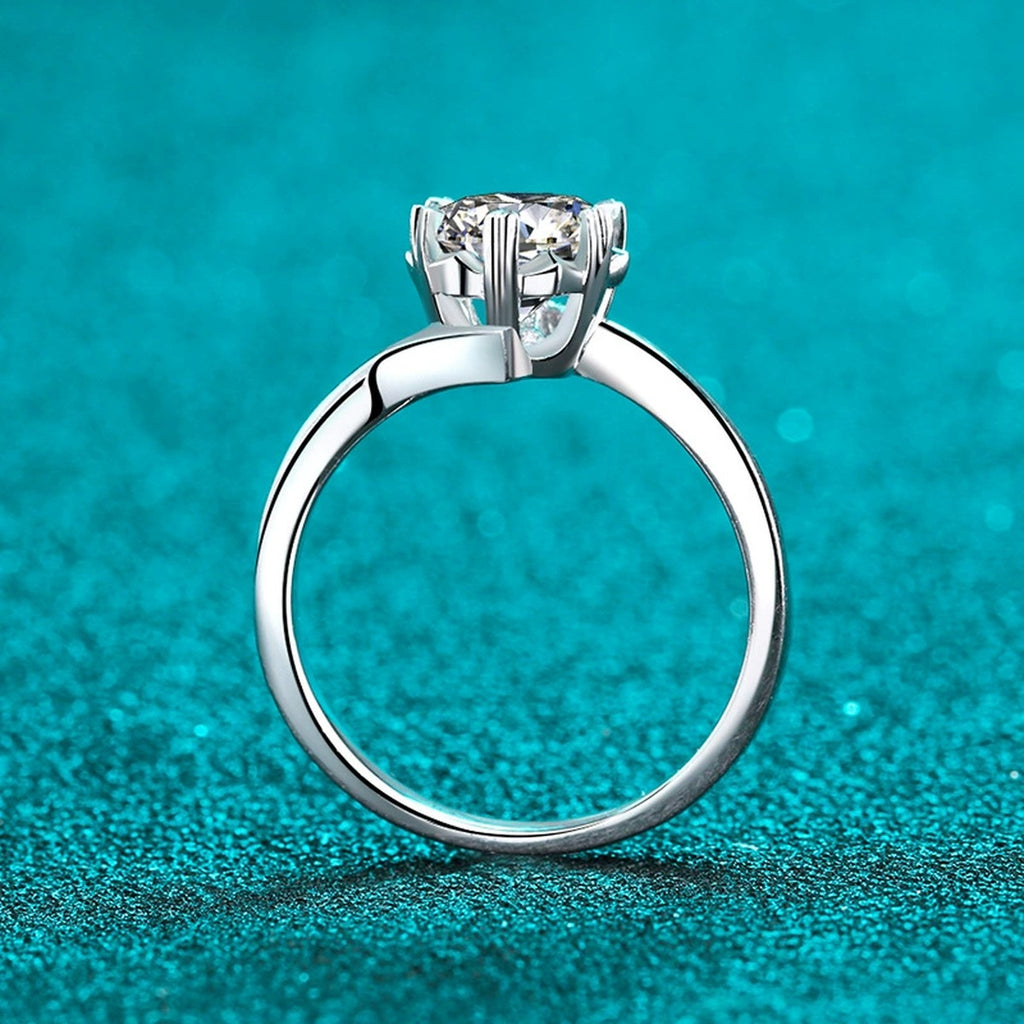 Round Moissanite Solitaire Ring in Rhodium-Plated S925 Sterling Silver blue display product photo showing the moissanite setting and band profile