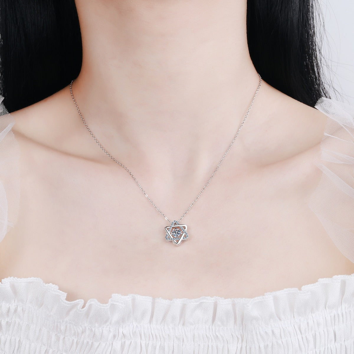Star Moissanite Pendant Necklace with CZ in Rhodium-Plated S925 sterling silver worn on neckline by model showing scale and adjustable chain styling