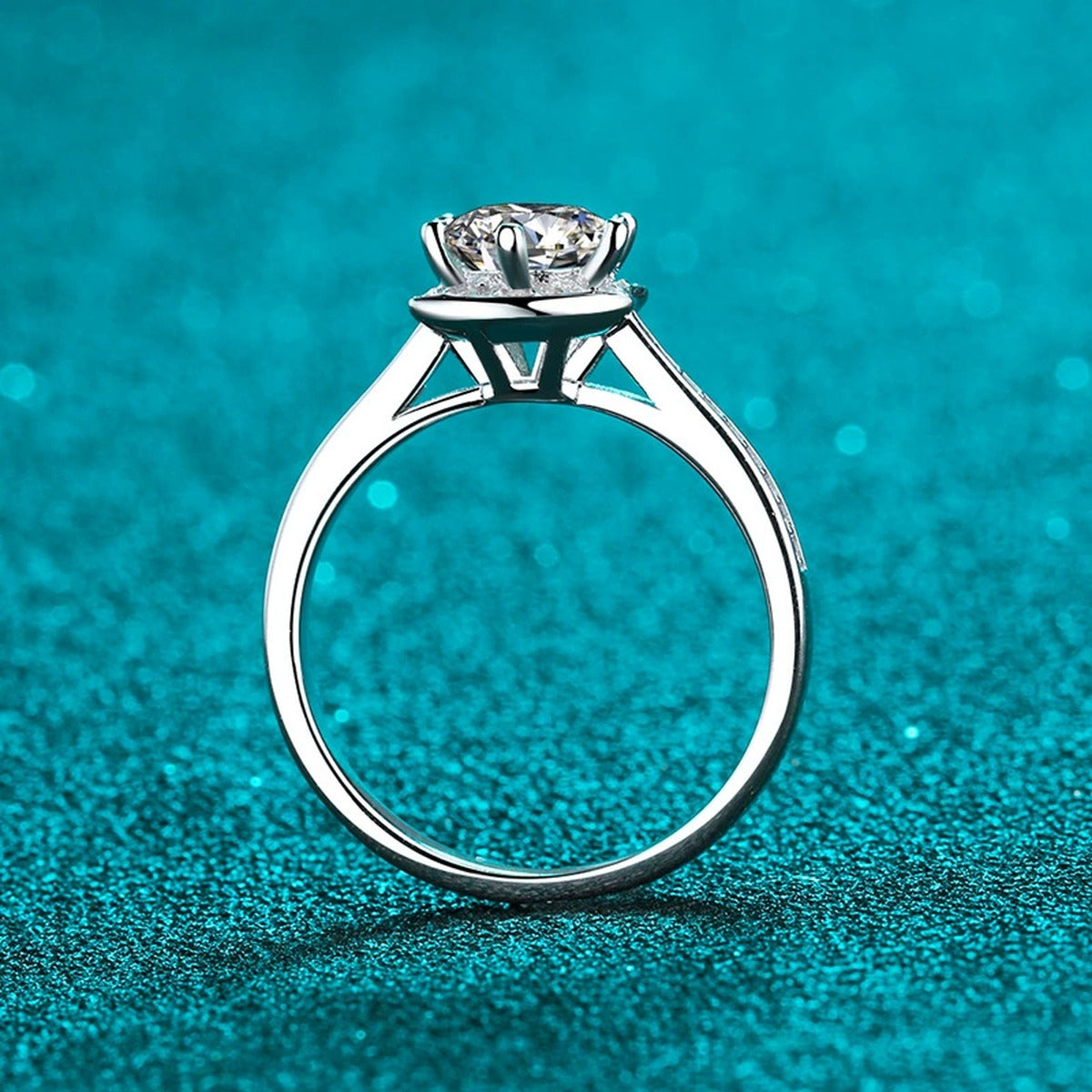 Round Moissanite Ring with CZ in Rhodium-Plated S925 Sterling Silver blue display product photo showing the moissanite setting and band profile