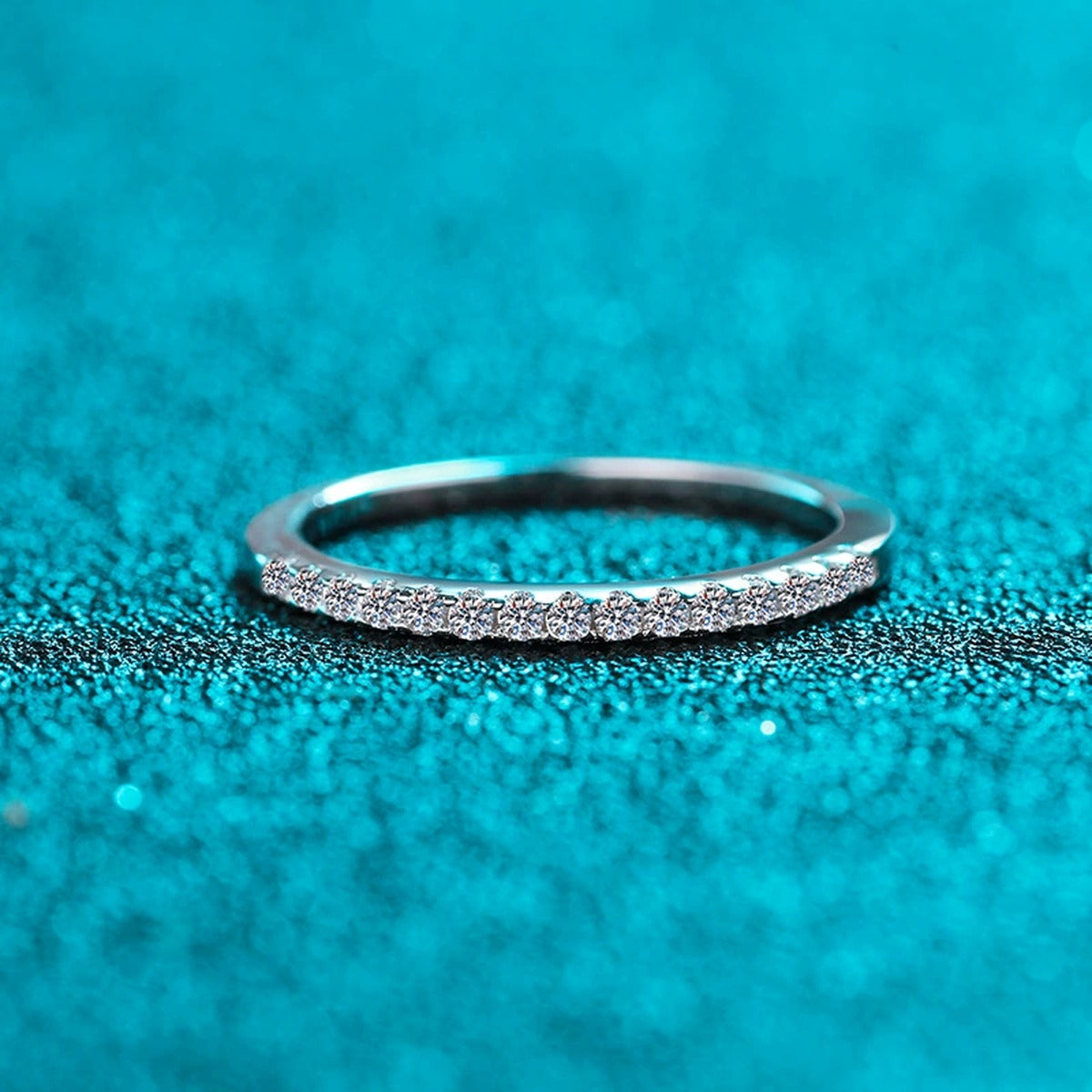 Pave Moissanite Band Ring in Rhodium-Plated S925 Sterling Silver blue display product photo showing the moissanite setting and band profile