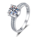 Round Moissanite Side Stone Engagement Ring with CZ in rhodium-plated S925 sterling silver on clean white background