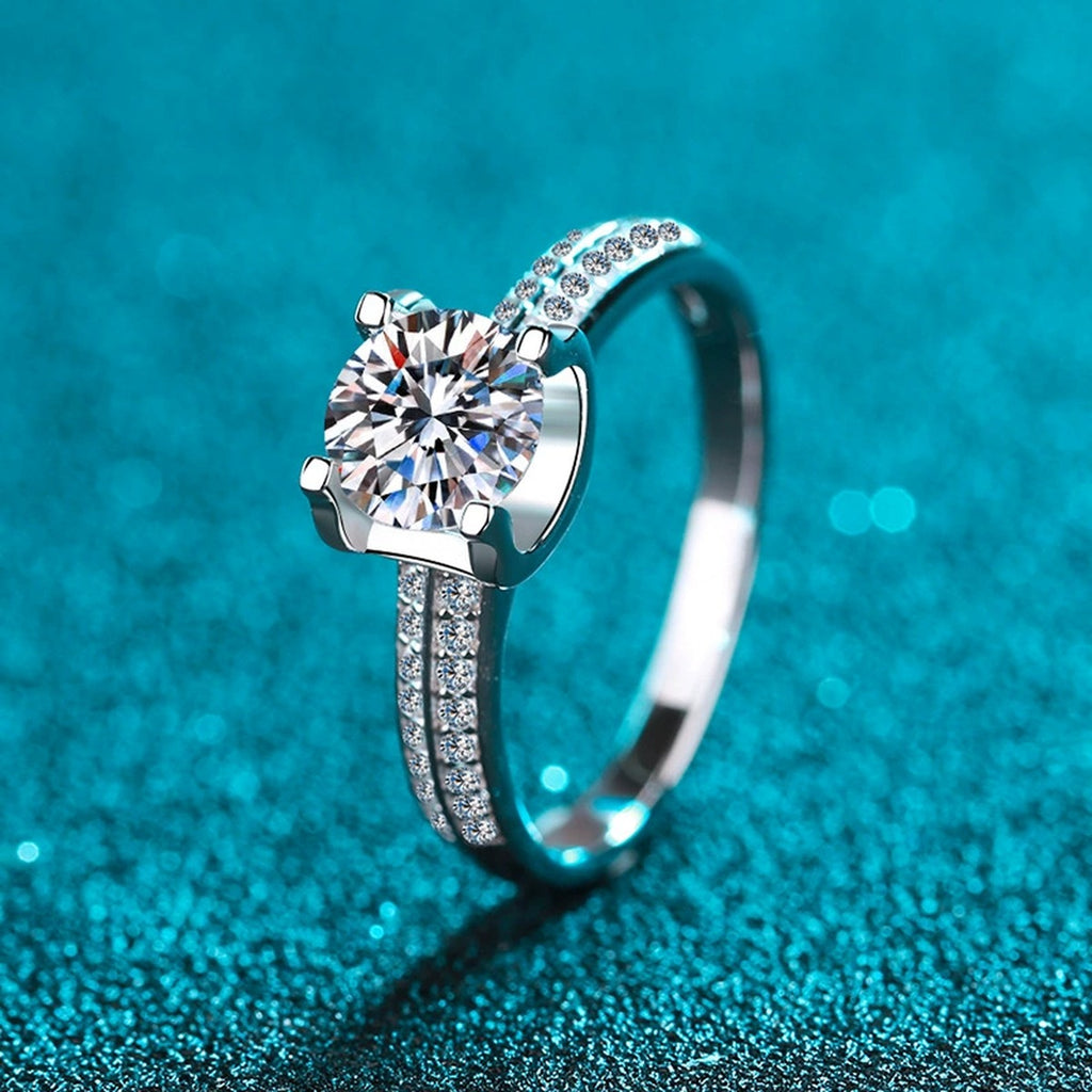 Round Moissanite Side Stone Engagement Ring with CZ product view showing moissanite setting and metal finish