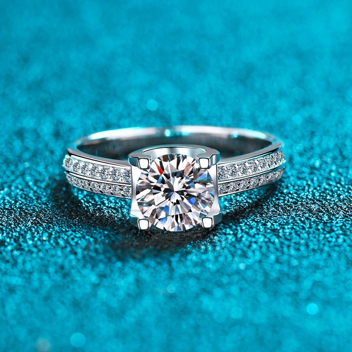 Round Moissanite Side Stone Engagement Ring with CZ product view showing moissanite setting and metal finish