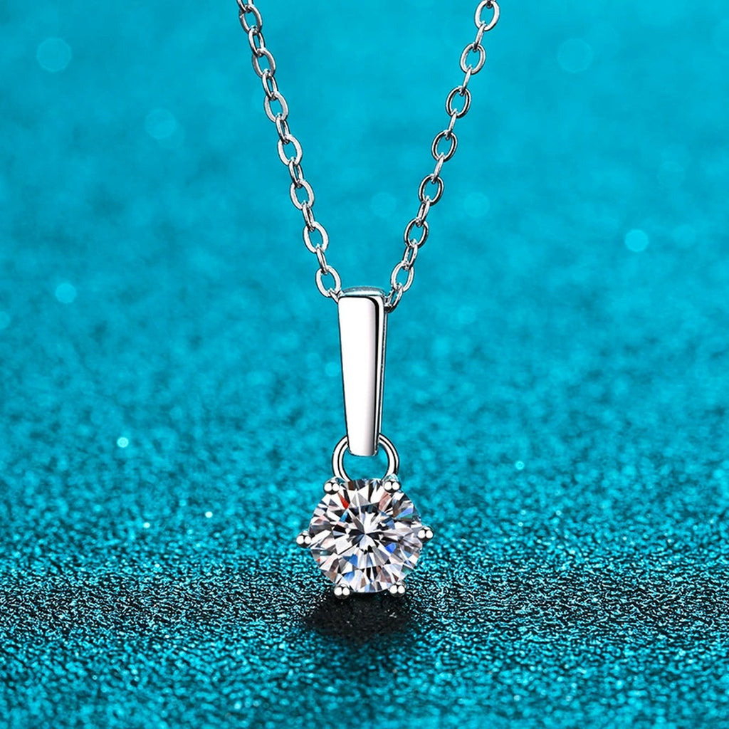 Solitaire Moissanite Pendant Necklace in Rhodium-Plated S925 sterling silver product scene view showing chain and setting detail