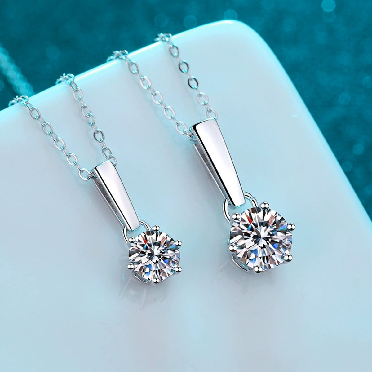 Solitaire Moissanite Pendant Necklace in Rhodium-Plated S925 sterling silver product scene view showing angled sparkle