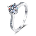 Round Moissanite Side Stone Engagement Ring with CZ in rhodium-plated S925 sterling silver on clean white background