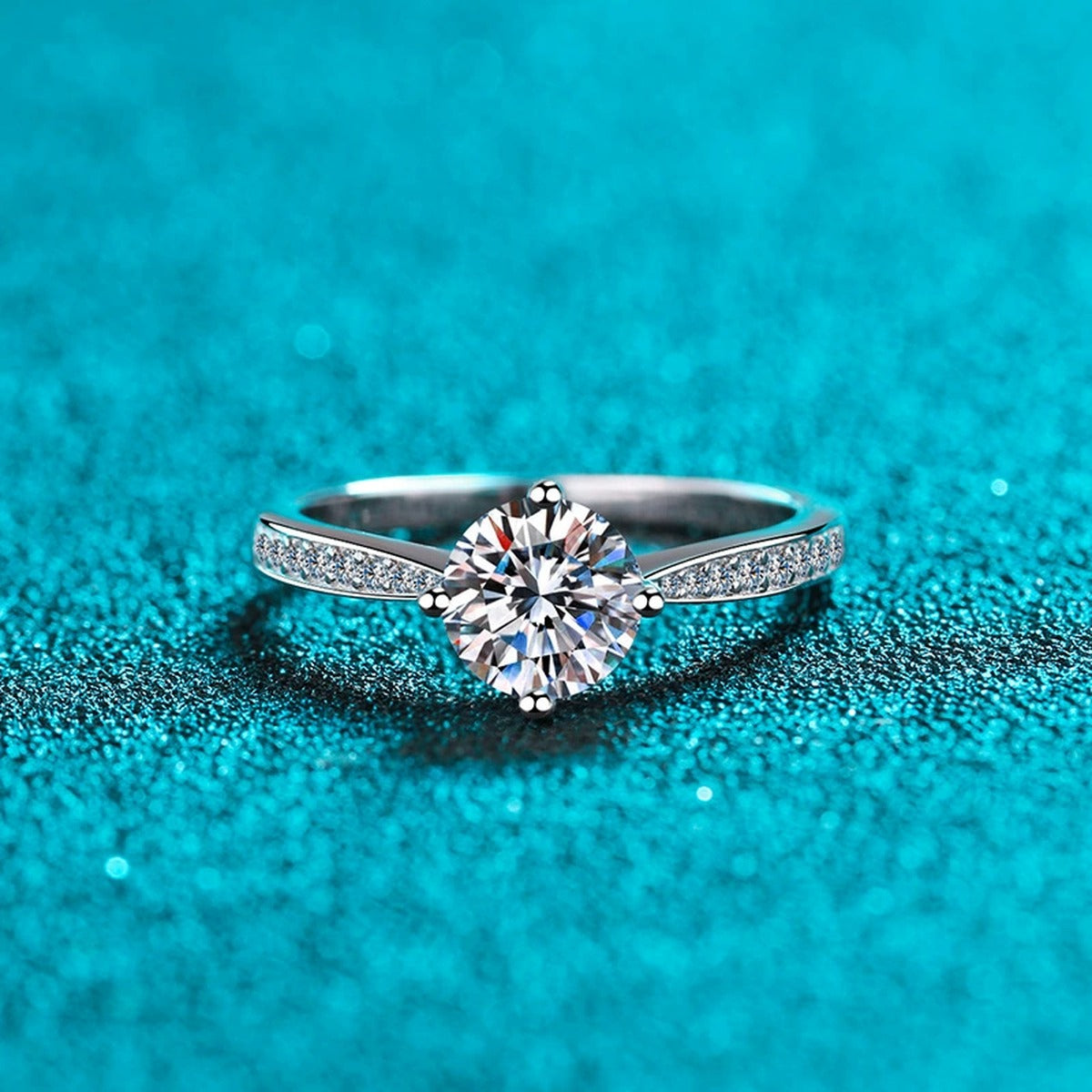 Round Moissanite Side Stone Engagement Ring with CZ product view showing moissanite setting and metal finish