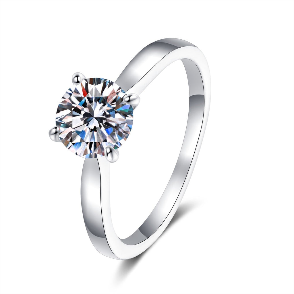 Round Moissanite Solitaire Ring in Rhodium-Plated S925 Sterling Silver clean white background product photo showing the ring silhouette and moissanite setting
