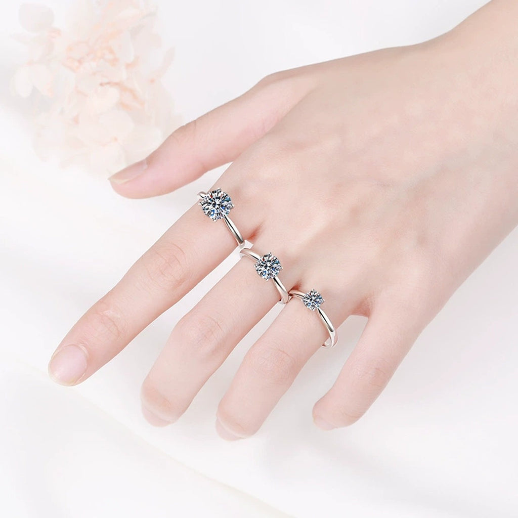 Round Moissanite Solitaire Ring in Rhodium-Plated S925 Sterling Silver worn on hand, showing scale, finger coverage, and rhodium-plated finish