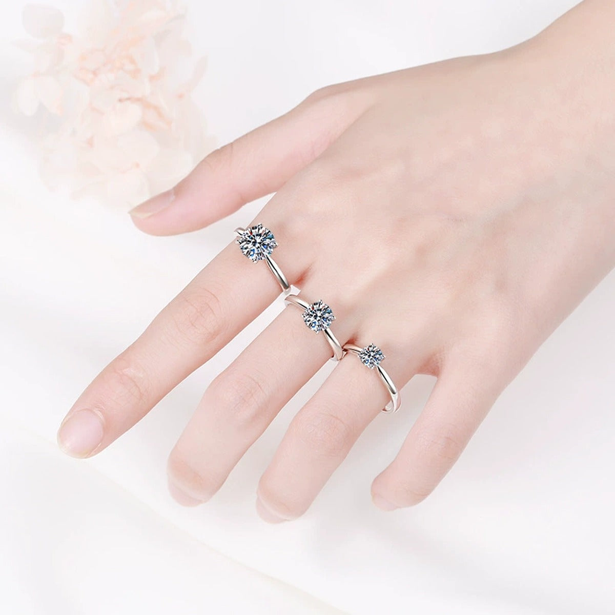 Round Moissanite Solitaire Ring in Rhodium-Plated S925 Sterling Silver worn on hand, showing scale, finger coverage, and rhodium-plated finish
