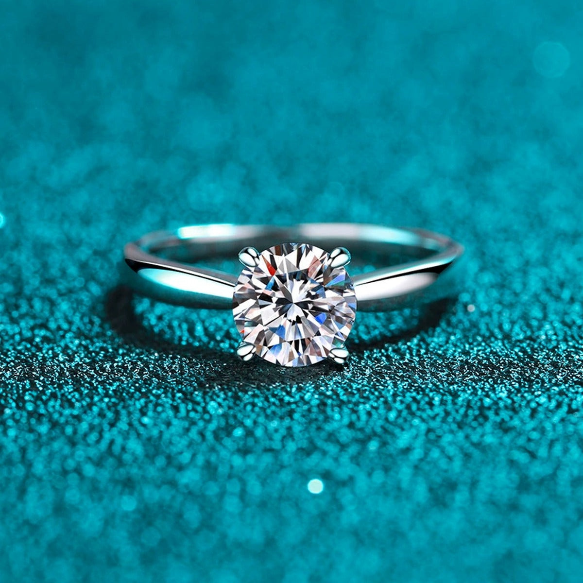 Round Moissanite Solitaire Ring in Rhodium-Plated S925 Sterling Silver blue display product photo showing the moissanite setting and band profile