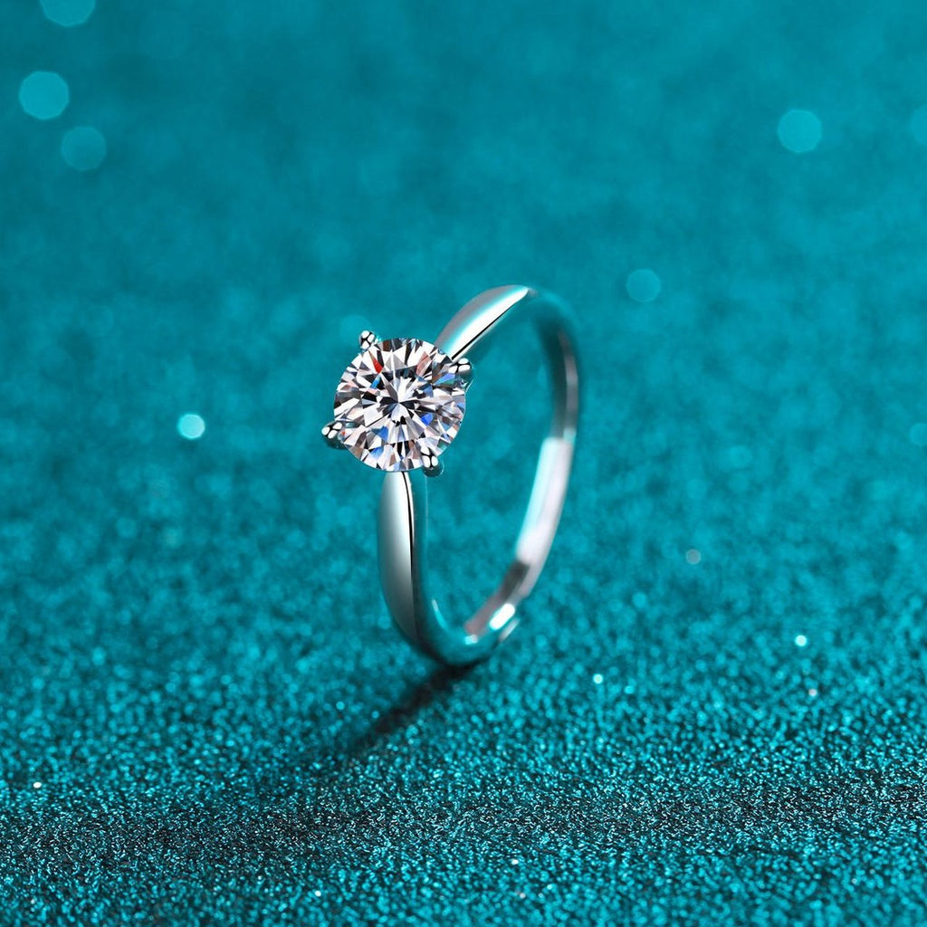 Round Moissanite Solitaire Ring in Rhodium-Plated S925 Sterling Silver blue display product photo showing the moissanite setting and band profile