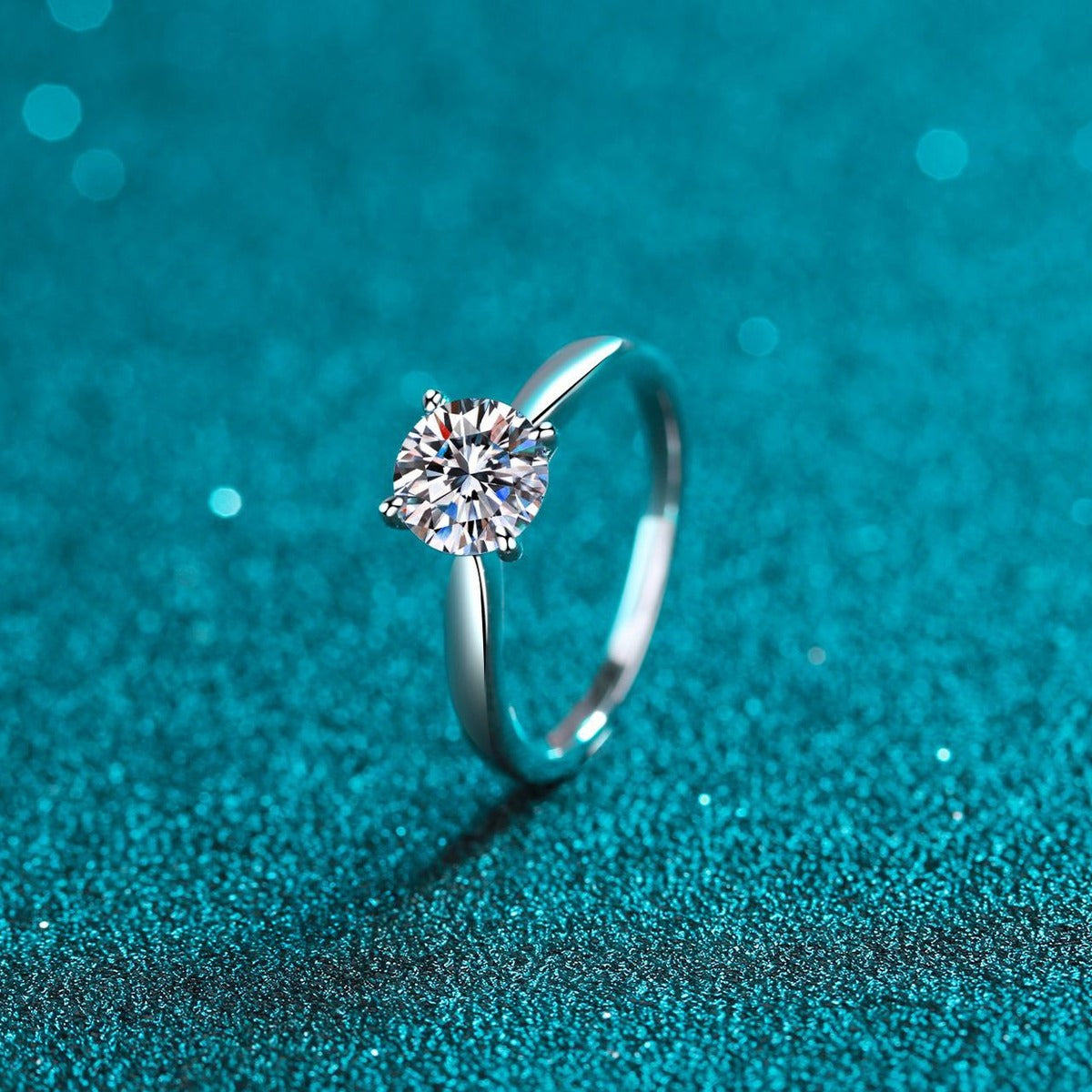 Round Moissanite Solitaire Ring in Rhodium-Plated S925 Sterling Silver blue display product photo showing the moissanite setting and band profile