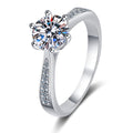Round Moissanite Side Stone Ring with CZ in Rhodium-Plated S925 Sterling Silver clean white background product photo showing the ring silhouette and moissanite setting