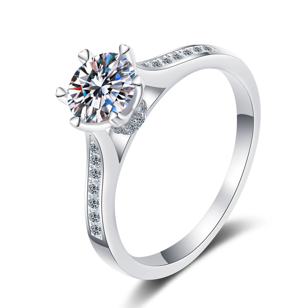 Round Moissanite Side Stone Engagement Ring with CZ in rhodium-plated S925 sterling silver on clean white background