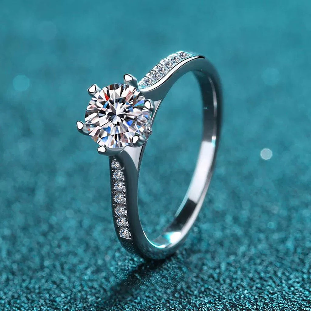 Round Moissanite Side Stone Engagement Ring with CZ product view showing moissanite setting and metal finish
