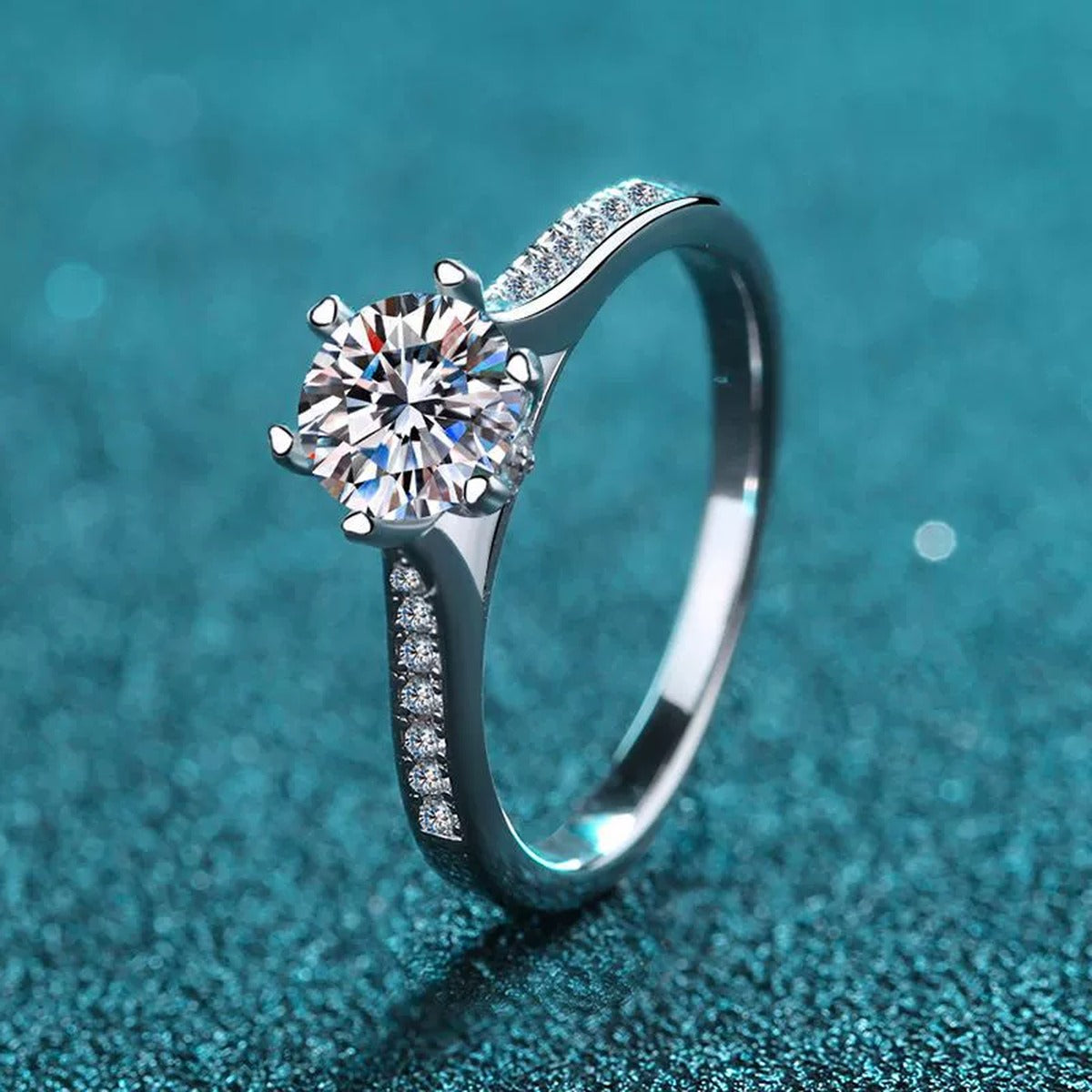 Round Moissanite Side Stone Engagement Ring with CZ product view showing moissanite setting and metal finish