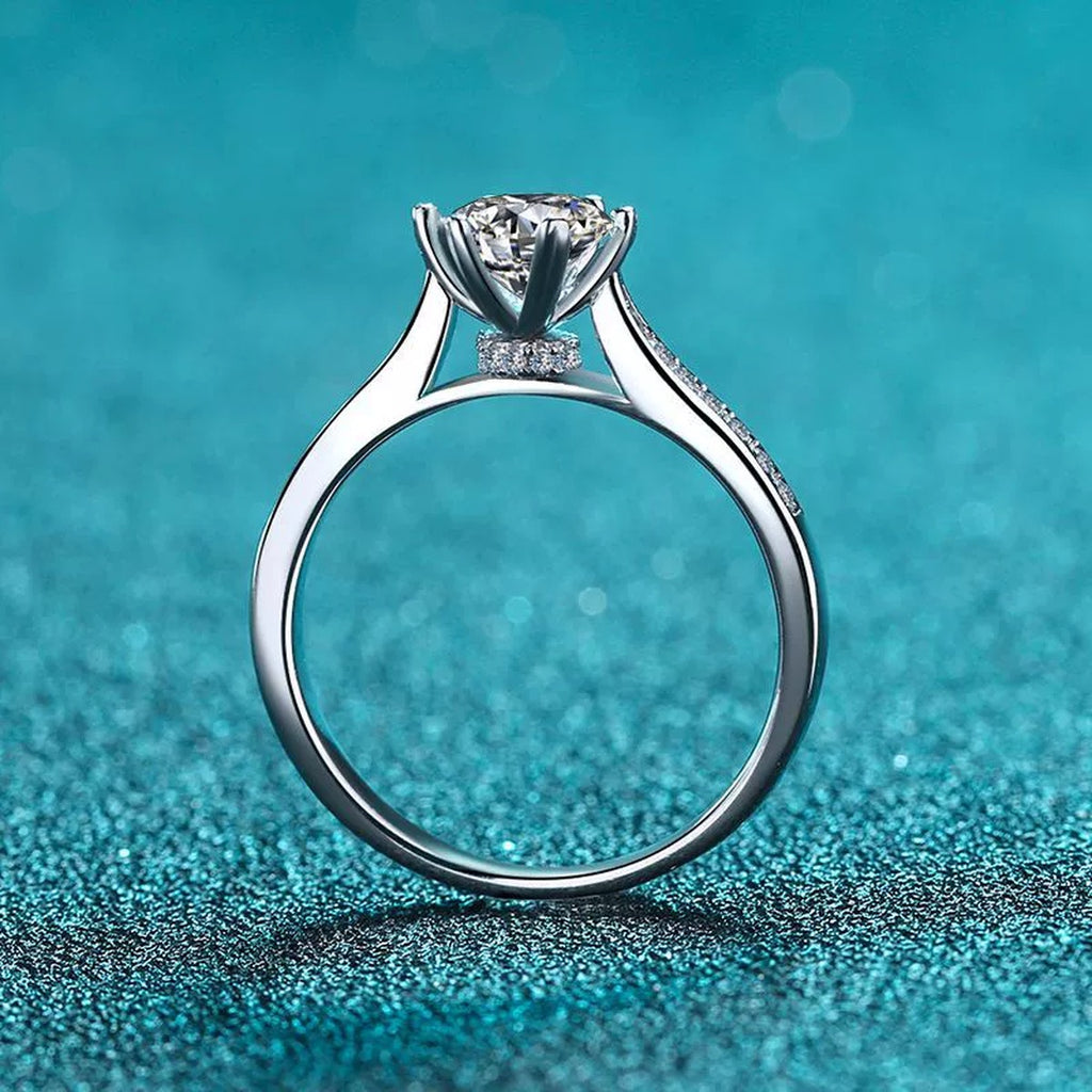Round Moissanite Side Stone Engagement Ring with CZ product view showing moissanite setting and metal finish