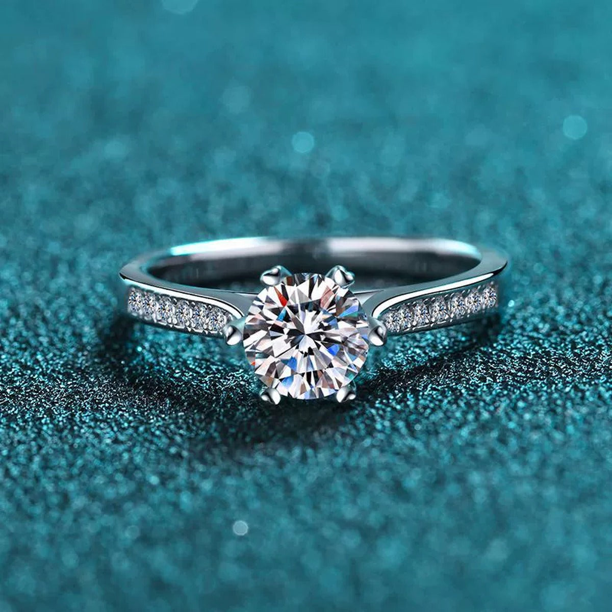 Round Moissanite Side Stone Engagement Ring with CZ product view showing moissanite setting and metal finish
