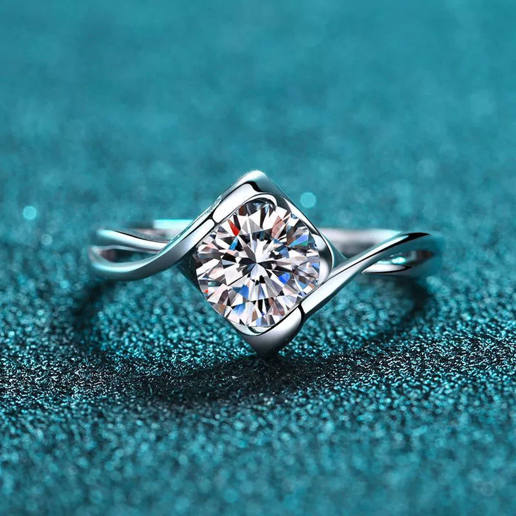 Round Moissanite Twist Ring product view showing moissanite setting and metal finish