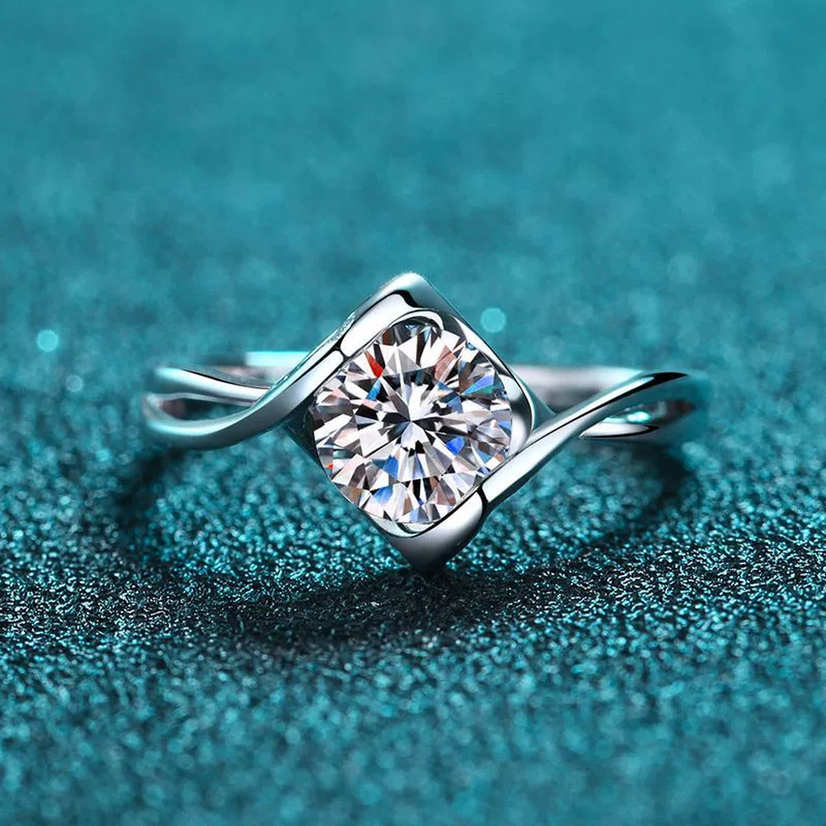 Round Moissanite Twist Ring product view showing moissanite setting and metal finish