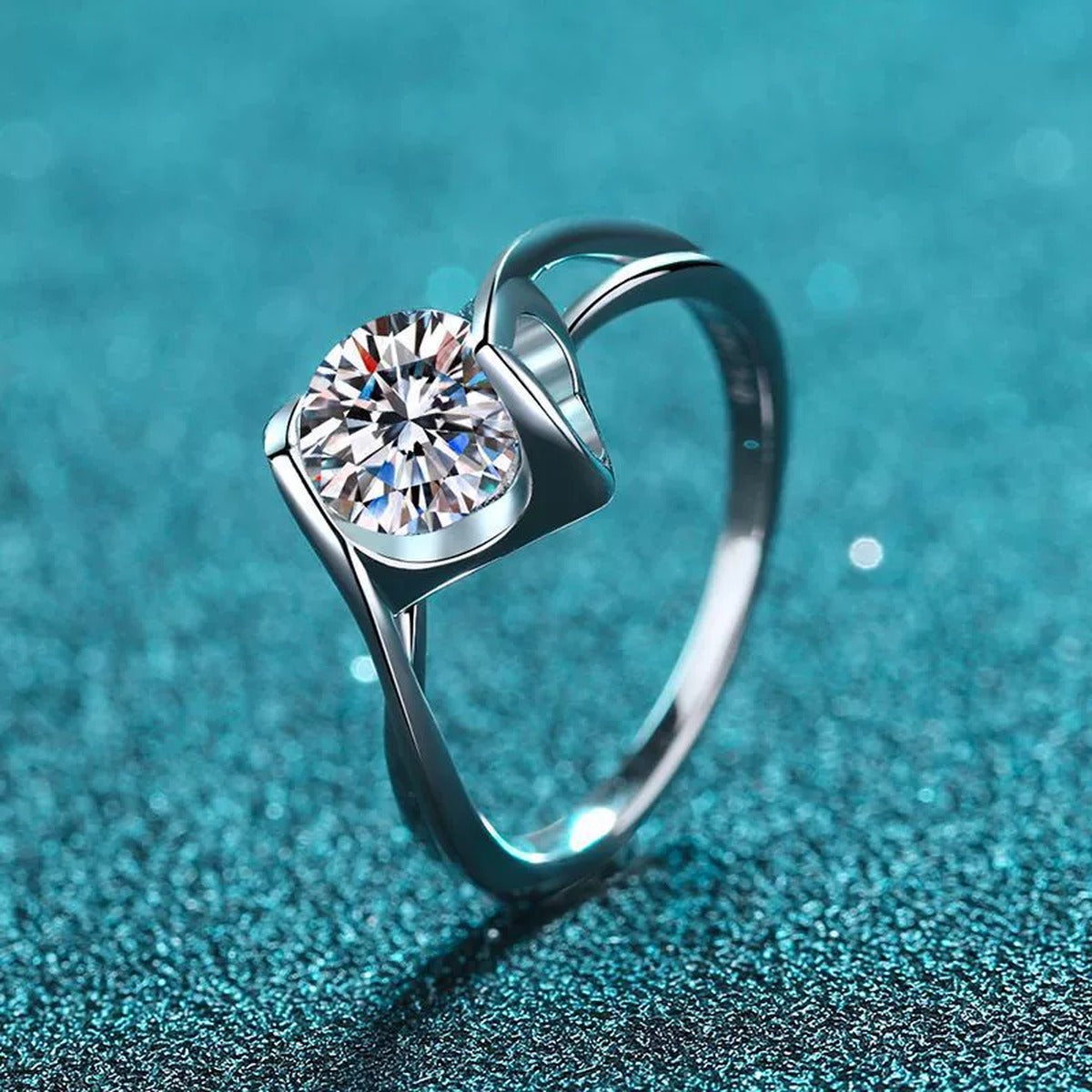 Round Moissanite Twist Ring product view showing moissanite setting and metal finish