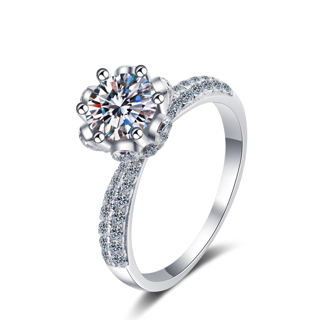 Round Moissanite Side Stone Ring with CZ in Rhodium-Plated S925 Sterling Silver clean white background product photo showing the ring silhouette and moissanite setting