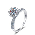 Round Moissanite Side Stone Ring with CZ in Rhodium-Plated S925 Sterling Silver clean white background product photo showing the ring silhouette and moissanite setting