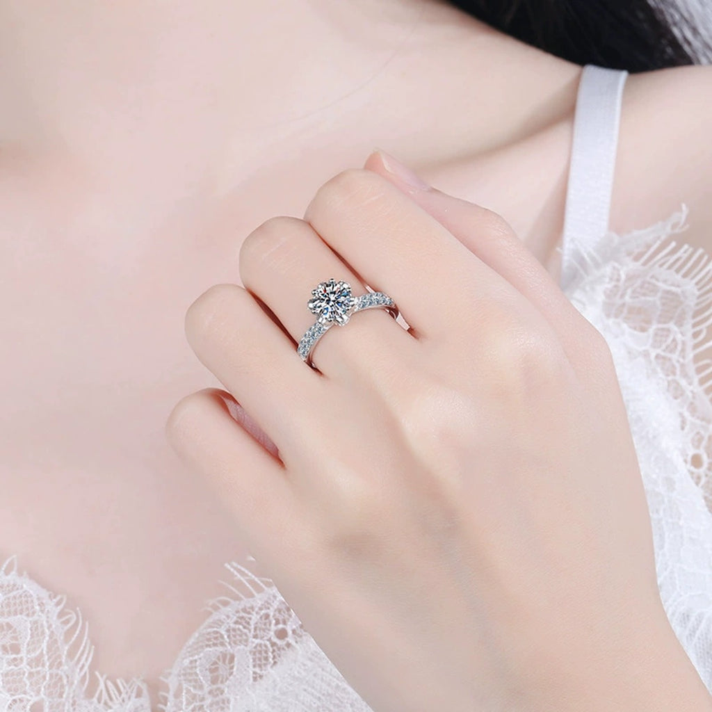 Round Moissanite Side Stone Ring with CZ in Rhodium-Plated S925 Sterling Silver worn on hand, showing scale, finger coverage, and rhodium-plated finish