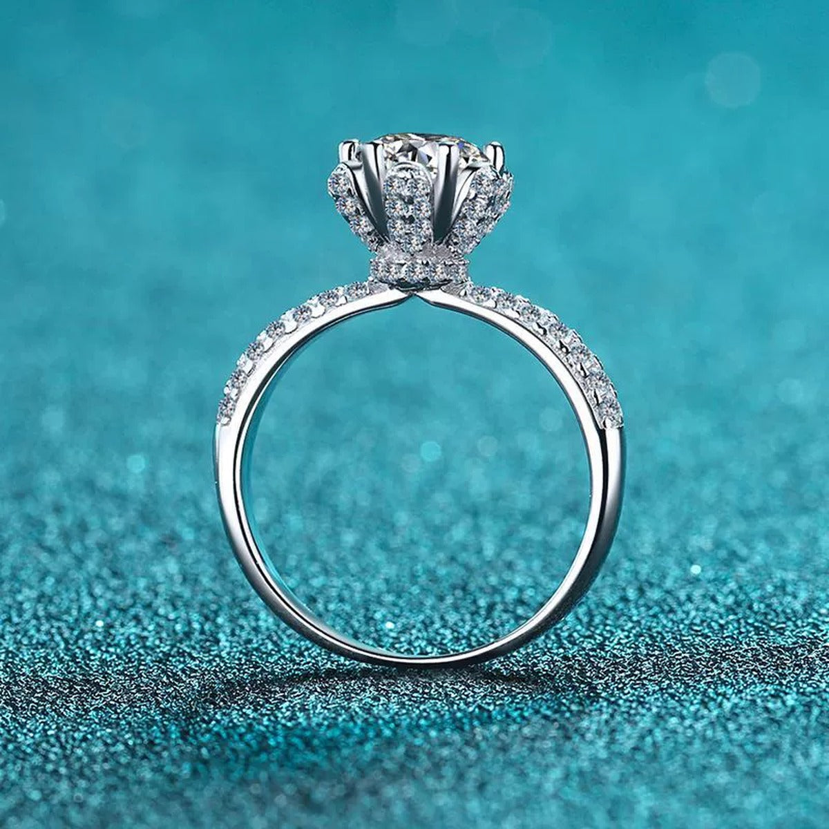 Round Moissanite Side Stone Ring with CZ in Rhodium-Plated S925 Sterling Silver blue display product photo showing the moissanite setting and band profile