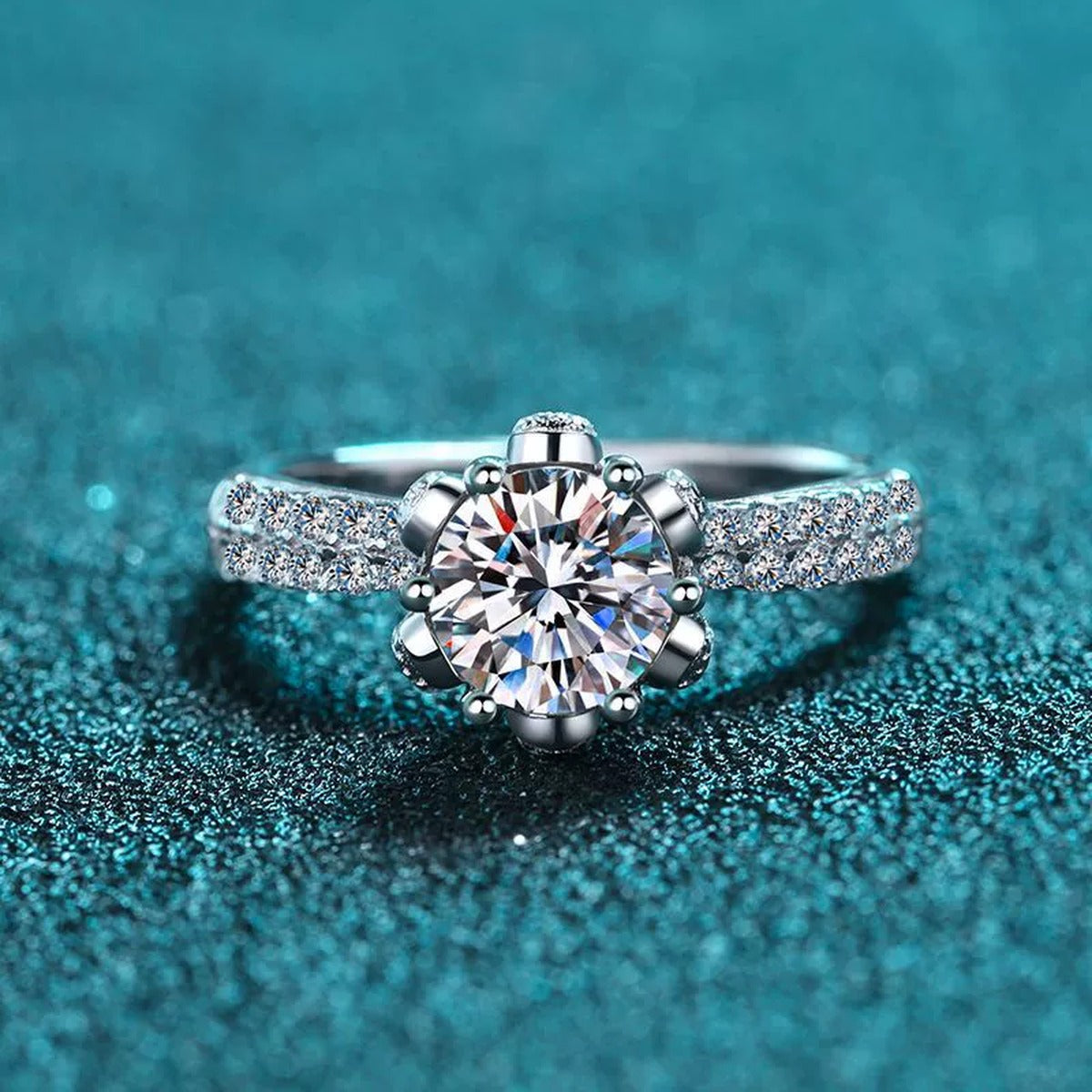 Round Moissanite Side Stone Ring with CZ in Rhodium-Plated S925 Sterling Silver blue display product photo showing the moissanite setting and band profile